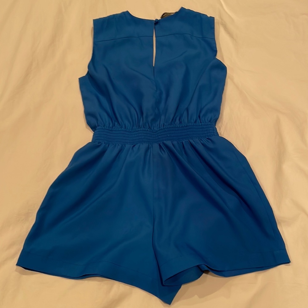 Blue Bebe romper never worn.